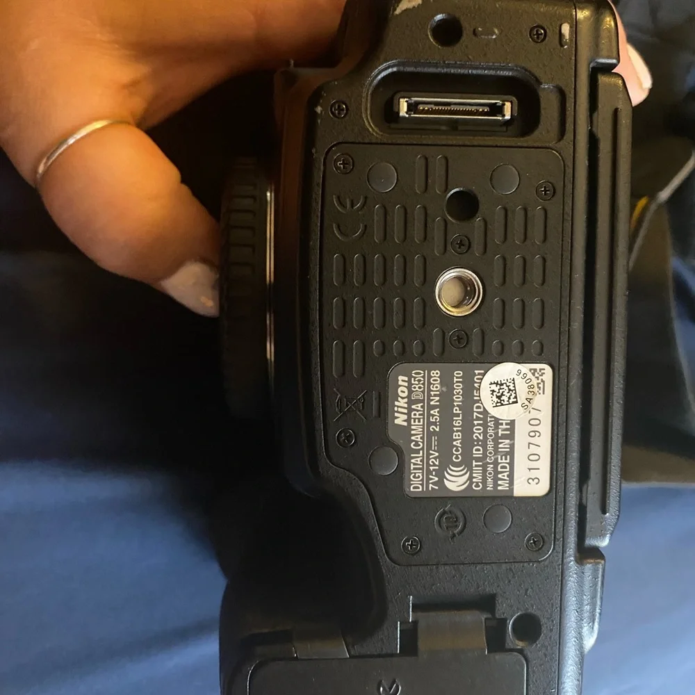 Nikon D850 digital black camera. With battery charger